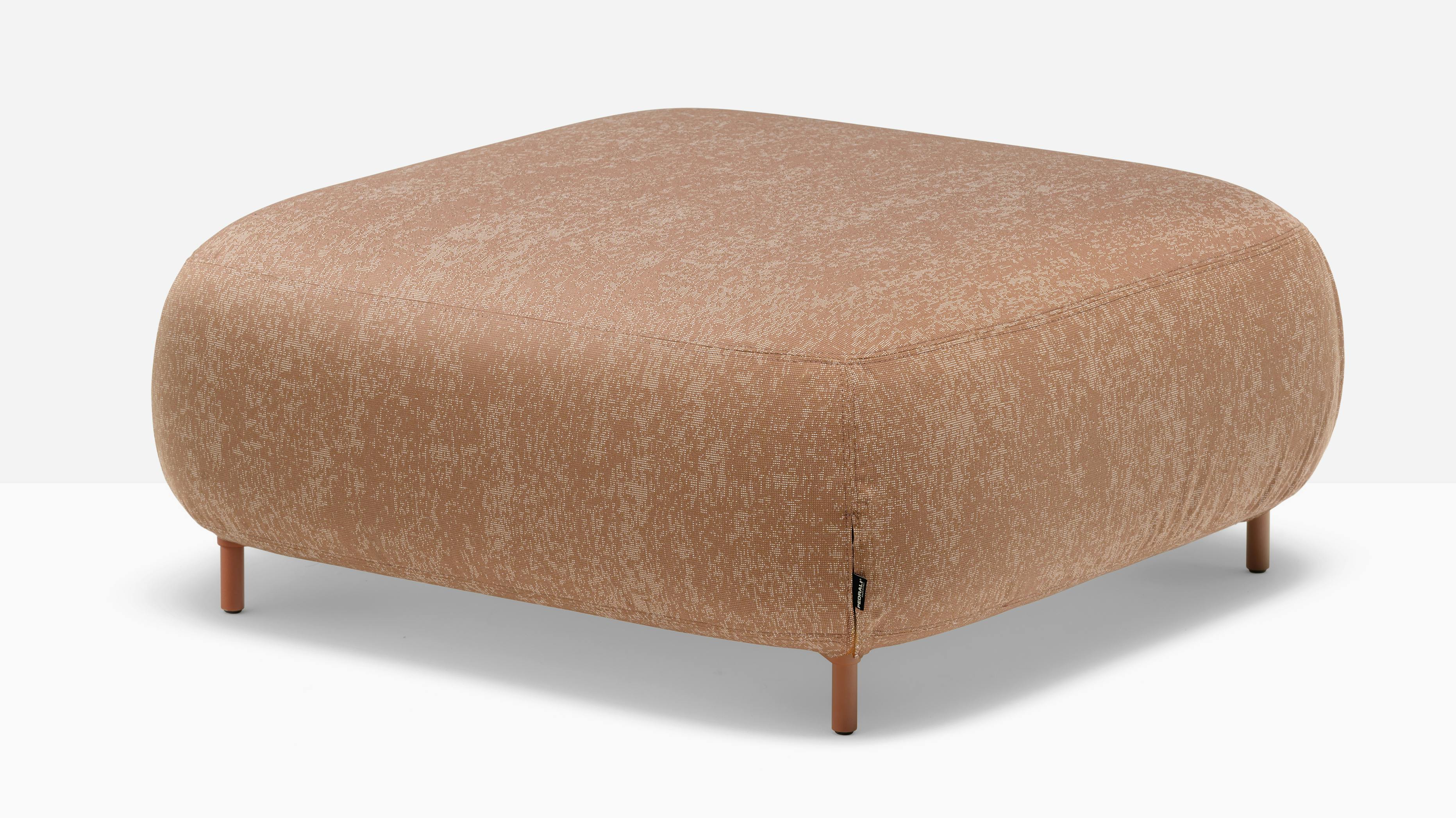 Buddy is an upholstered pouf crafted for outdoor durability.