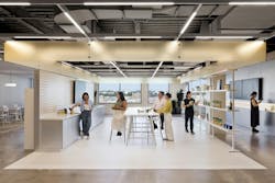 Unilever headquarters’ centrally located “Show & Tell” area connects different modular innovation zones, illuminated by linear ceiling fixtures and set off by light wood surfaces and white cabinetry and shelving. Unilever headquarters’ centrally located “Show & Tell” area connects different modular innovation zones, illuminated by linear ceiling fixtures and set off by light wood surfaces and white cabinetry and shelving.