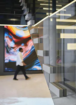 Hallway and stairwell view to AllianceBernstein Dreamwall digital display integration Hallway and stairwell view to AllianceBernstein Dreamwall digital display integration