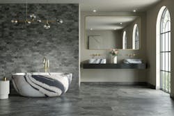 A fluid flow of variegated quartzite look porcelain surfaces on bathroom floor and walls A fluid flow of variegated quartzite look porcelain surfaces on bathroom floor and walls
