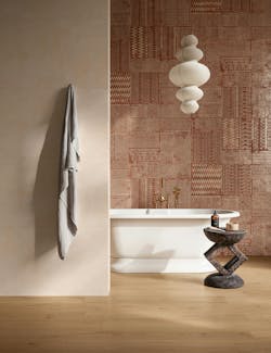 Textural tile in subtle sunwashed terracotta hue on a bathroom wall Textural tile in subtle sunwashed terracotta hue on a bathroom wall
