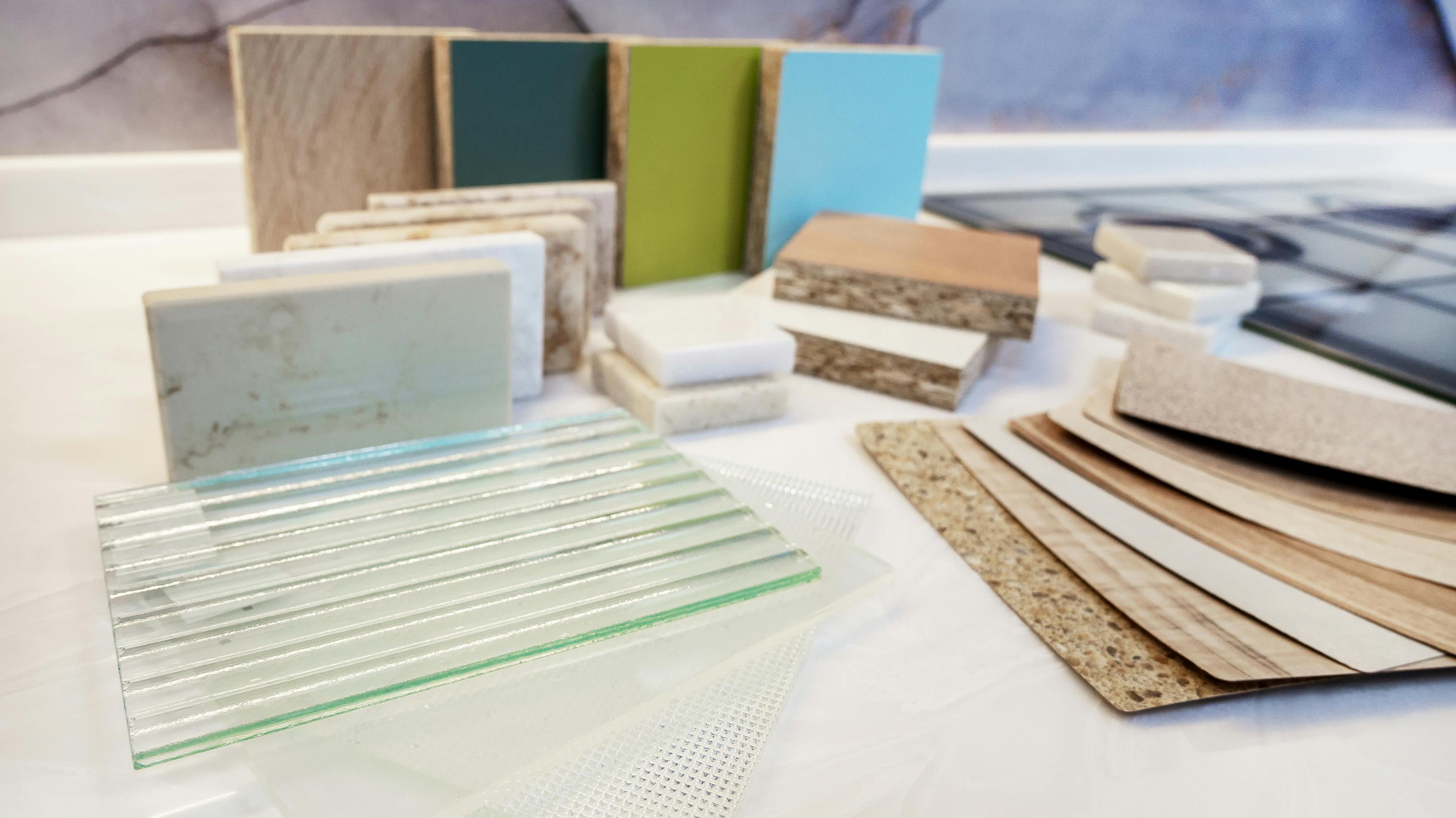 A variety of building material samples including glass, stone, tile, wood and laminates.