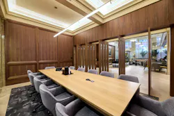 A dedicated conference floor incorporates rich wood paneling, metal accents, and plush seating for informal collaboration and formal presentations. A dedicated conference floor incorporates rich wood paneling, metal accents, and plush seating for informal collaboration and formal presentations.