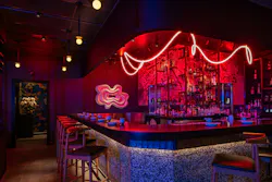 Moody bar atmosphere enhanced with curved lighting Moody bar atmosphere enhanced with curved lighting