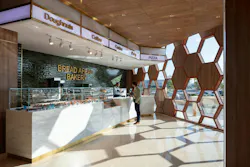 Bakery grab-and-go space in hospital with hexagonal-shaped wall with window cut-outs. Bakery grab-and-go space in hospital with hexagonal-shaped wall with window cut-outs.