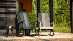 Fredricksonn rocking chairs set on an outdoor patio. Fredricksonn rocking chairs set on an outdoor patio.