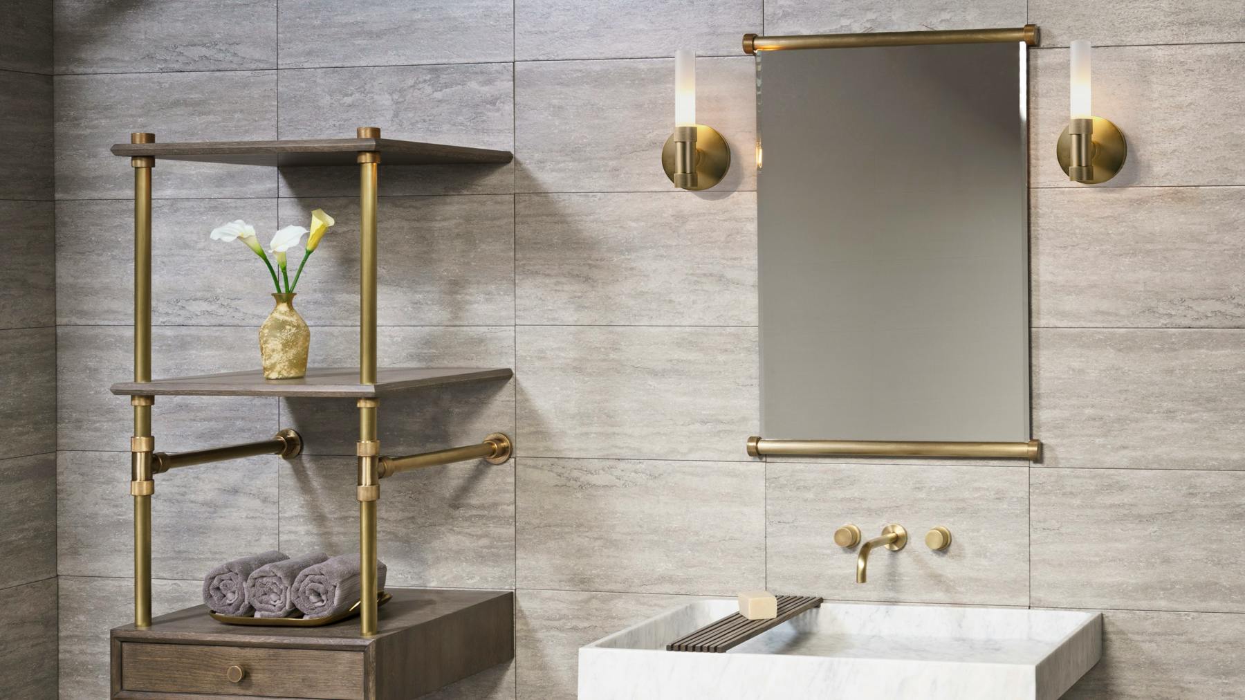 The Elemental Mirror is framed in metal with signature knurled fittings.