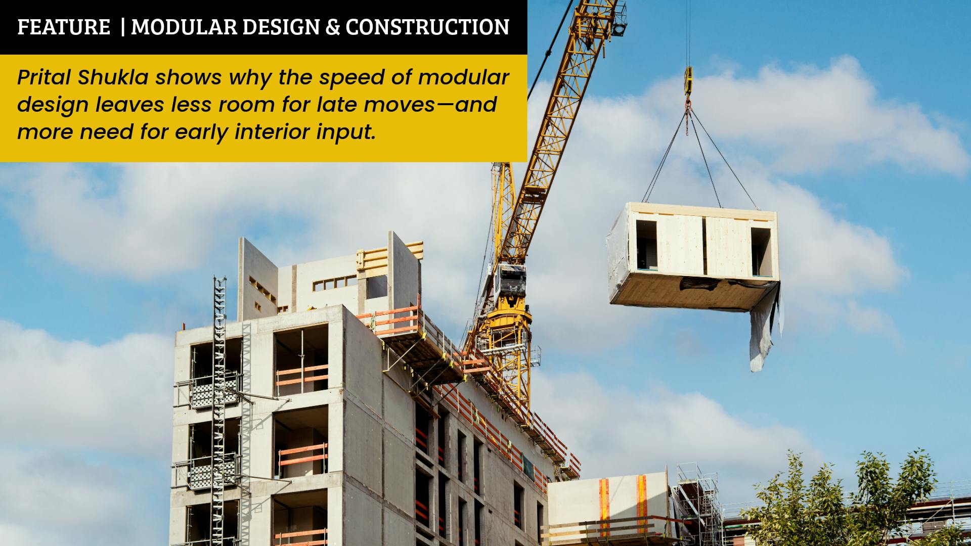 Construction site of multiresidential apartment building with modular unit on crane