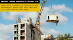 Construction site of multiresidential apartment building with modular unit on crane Construction site of multiresidential apartment building with modular unit on crane