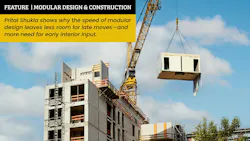 Construction site of multiresidential apartment building with modular unit on crane Construction site of multiresidential apartment building with modular unit on crane