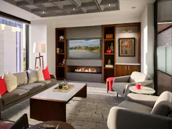 Intimate and warm library room with fireplace, adjustable window hangings, and soft seating for quiet breaks Intimate and warm library room with fireplace, adjustable window hangings, and soft seating for quiet breaks