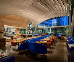 The open floorplan at Fleurette draws guests from entry through to the bar where banquettes and booths create an intuitive path for serving staff. The open floorplan at Fleurette draws guests from entry through to the bar where banquettes and booths create an intuitive path for serving staff.