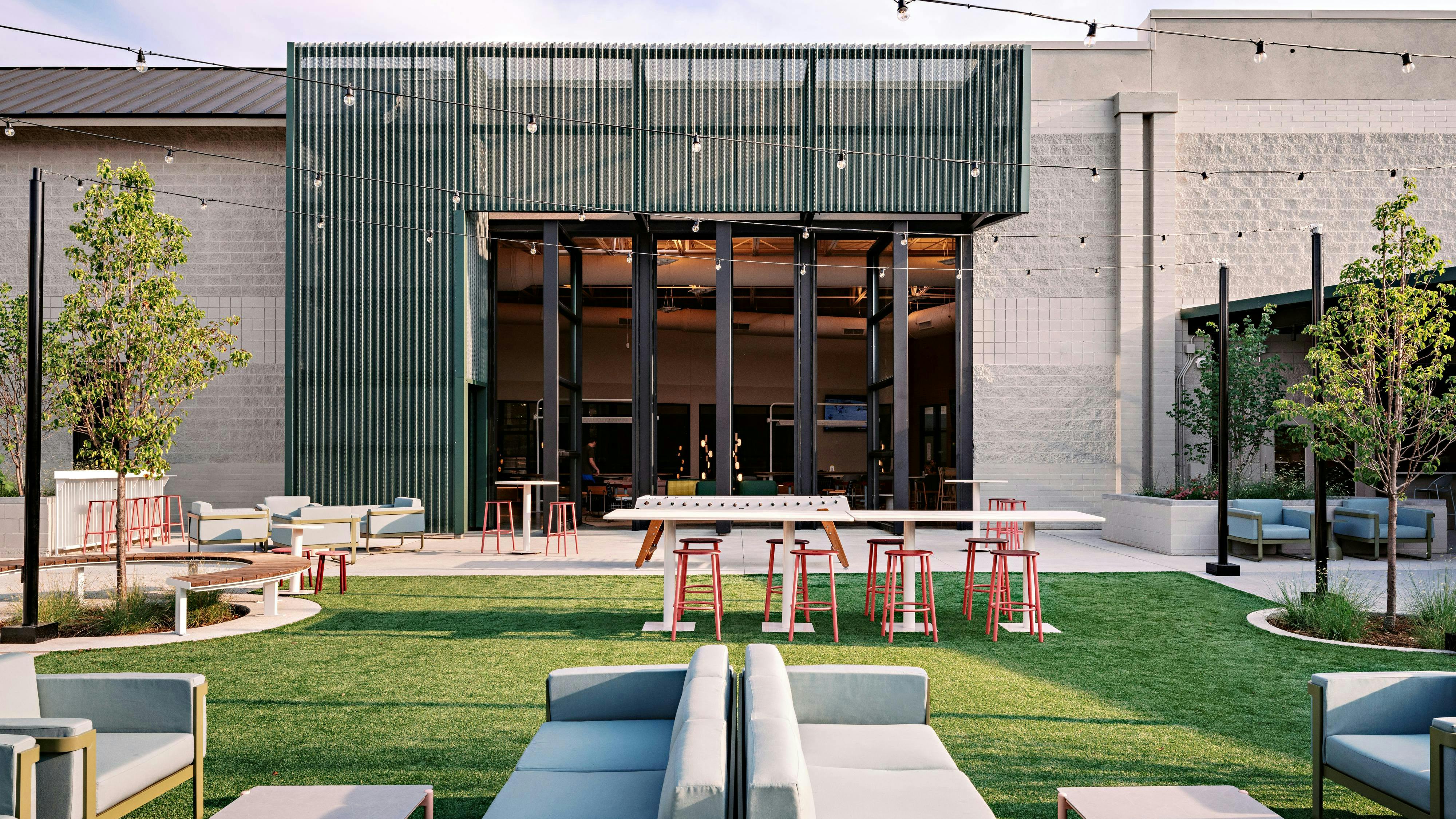 Outdoor courtyard with a variety of seating and tables.