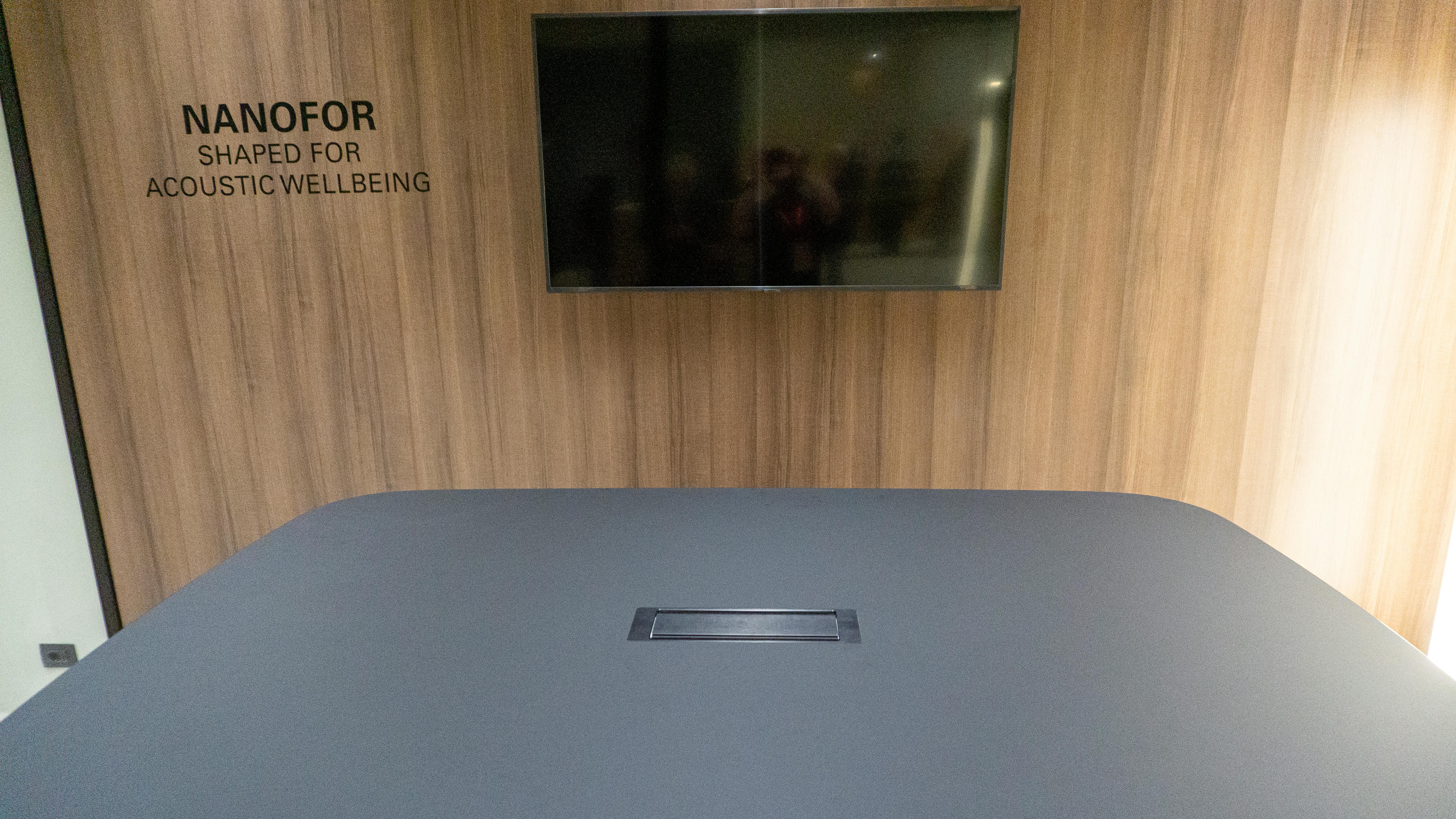 Faux-leather-wrapped, recycled-wood composite panel material at Fantoni display