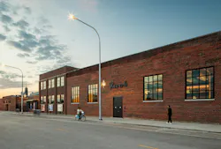 Reverb building exterior with windows opening to pedestrian walkway Reverb building exterior with windows opening to pedestrian walkway