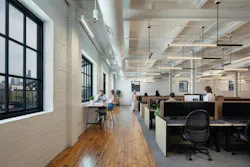 Workstations with dividers along a glazed exterior-facing wall for natural daylight and views to outdoors Workstations with dividers along a glazed exterior-facing wall for natural daylight and views to outdoors