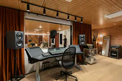 Recording studio and sound booth with acoustic ceiling, sound dampening textiles, and downlights Recording studio and sound booth with acoustic ceiling, sound dampening textiles, and downlights