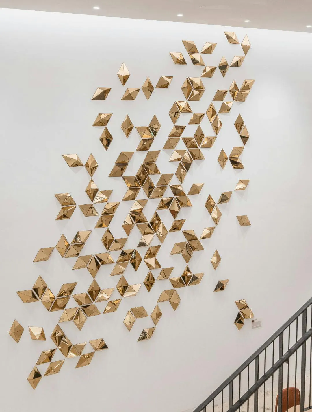 3D hanging sculpture of metallic gold pyramid shapes 3D hanging sculpture of metallic gold pyramid shapes