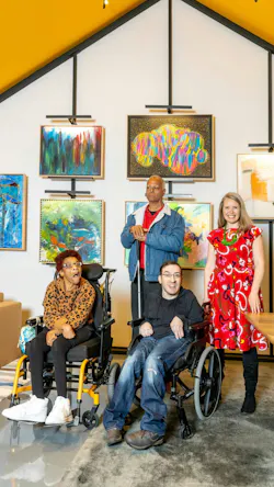 ArtLifting CEO and founder Liz Powers stands with two artists in wheelchairs and one standing with an assistive device in front of a colorful gallery wall ArtLifting CEO and founder Liz Powers stands with two artists in wheelchairs and one standing with an assistive device in front of a colorful gallery wall