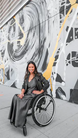 ArtLifting artist Aimee Hofmann celebrates a completed mural that showcases her signature swirling motifs in a public art installation supported by Verizon. ArtLifting artist Aimee Hofmann celebrates a completed mural that showcases her signature swirling motifs in a public art installation supported by Verizon.