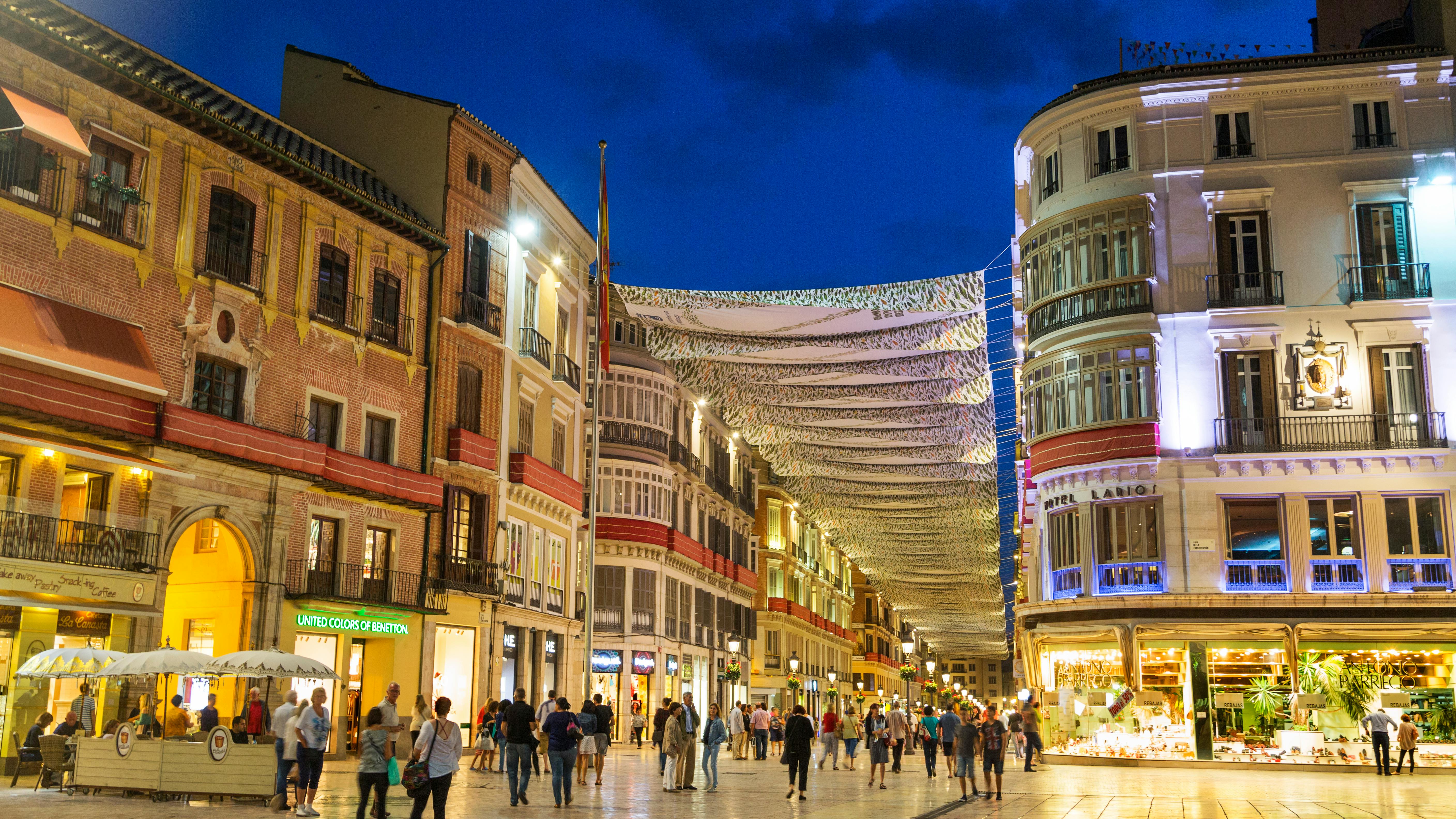 Busy retail district at night.