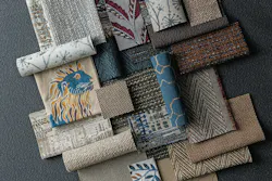 Layered woven textile swatches in patterns and hues of taupe, cream, muted blue, olive, rust, and gray Layered woven textile swatches in patterns and hues of taupe, cream, muted blue, olive, rust, and gray