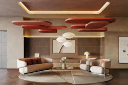 Informal lounge area with overhead acoustic ceiling pendants in rounded rectangular forms Informal lounge area with overhead acoustic ceiling pendants in rounded rectangular forms