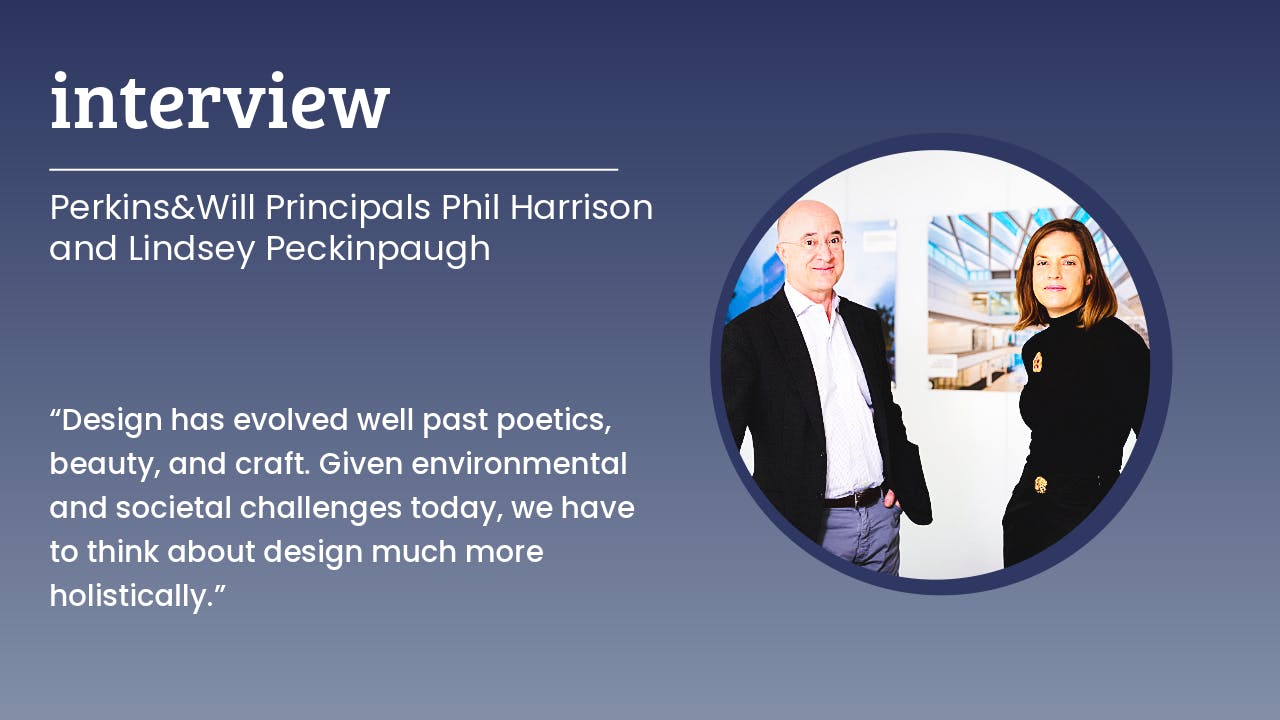 Perkins&Will firm principals Phil Harrison and Lindsey Peckinpaugh stand against a white interior room wall with design project photos in the background
