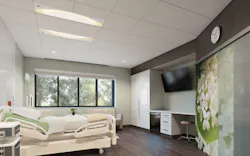 Focal Point Saros Duo light fixture (day mode) with comfortably bright white illumination in a patient room example Focal Point Saros Duo light fixture (day mode) with comfortably bright white illumination in a patient room example