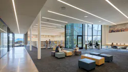 Open interior library space offers multiple seating arrangements and daylighting