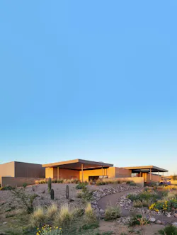 From the northeast, the library unfolds as low desert forms. Paths, plantings, and shade guide a gradual approach into a welcoming public place.