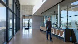 The library’s entry vestibule creates a calm transition using light, glass, and masonry to orient visitors while easing movement from the exterior to the library interior.