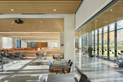 A large, open multipurpose space for events and conference activity is adjacent to a corridor and courtyard