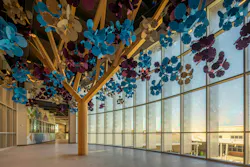 The wood and acoustic felt memorial tree honors lives lost in a 2022 mass shooting