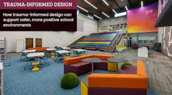 An elementary school library space designed with vivid sunset accent colors, modular furniture, linear lighting, and assembly stairs