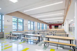 Interior long view of multi-use cafeteria and auditorium space