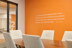 The university’s signature orange hue sets off an inspirational quote by Maya Angelou on a conference room wall in the new College of Nursing building.