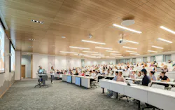 A lecture style classroom configuration with tiered tables and seating that can be easily modified for future needs