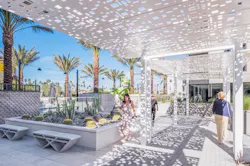 Residents can find shade along the covered pathway to the pool lounge area.