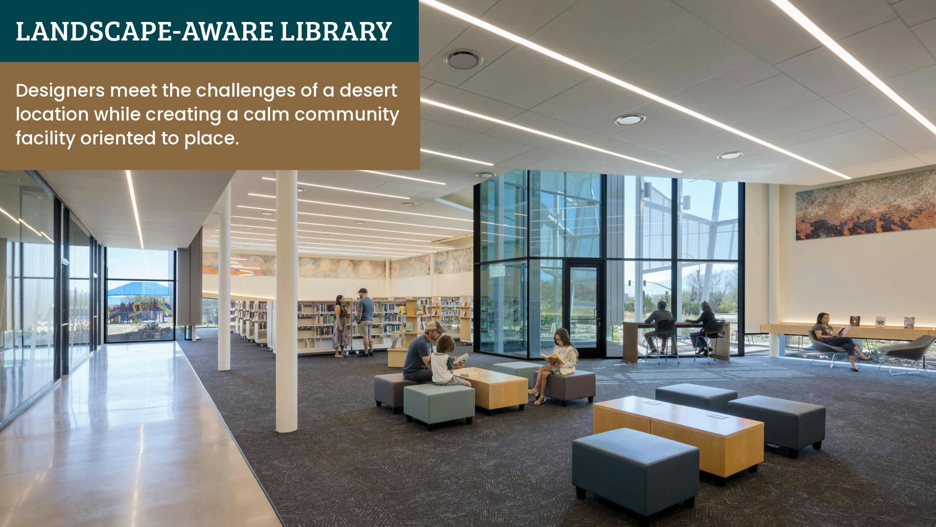 Open collections space in the library is accessed through the entry vestibule, with clear sightlines to individual glass-walled spaces and views to the distant mountains