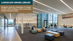 Open collections space in the library is accessed through the entry vestibule, with clear sightlines to individual glass-walled spaces and views to the distant mountains