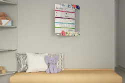 Ghent Swing Changeable Glassboard mounted on a patient's bedroom wall