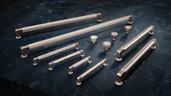 Elsinore decorative hardware collection, featuring rounded top inserts, hammered, knurled, pinstriped, and smooth pulls set on a counter, from California Faucets.