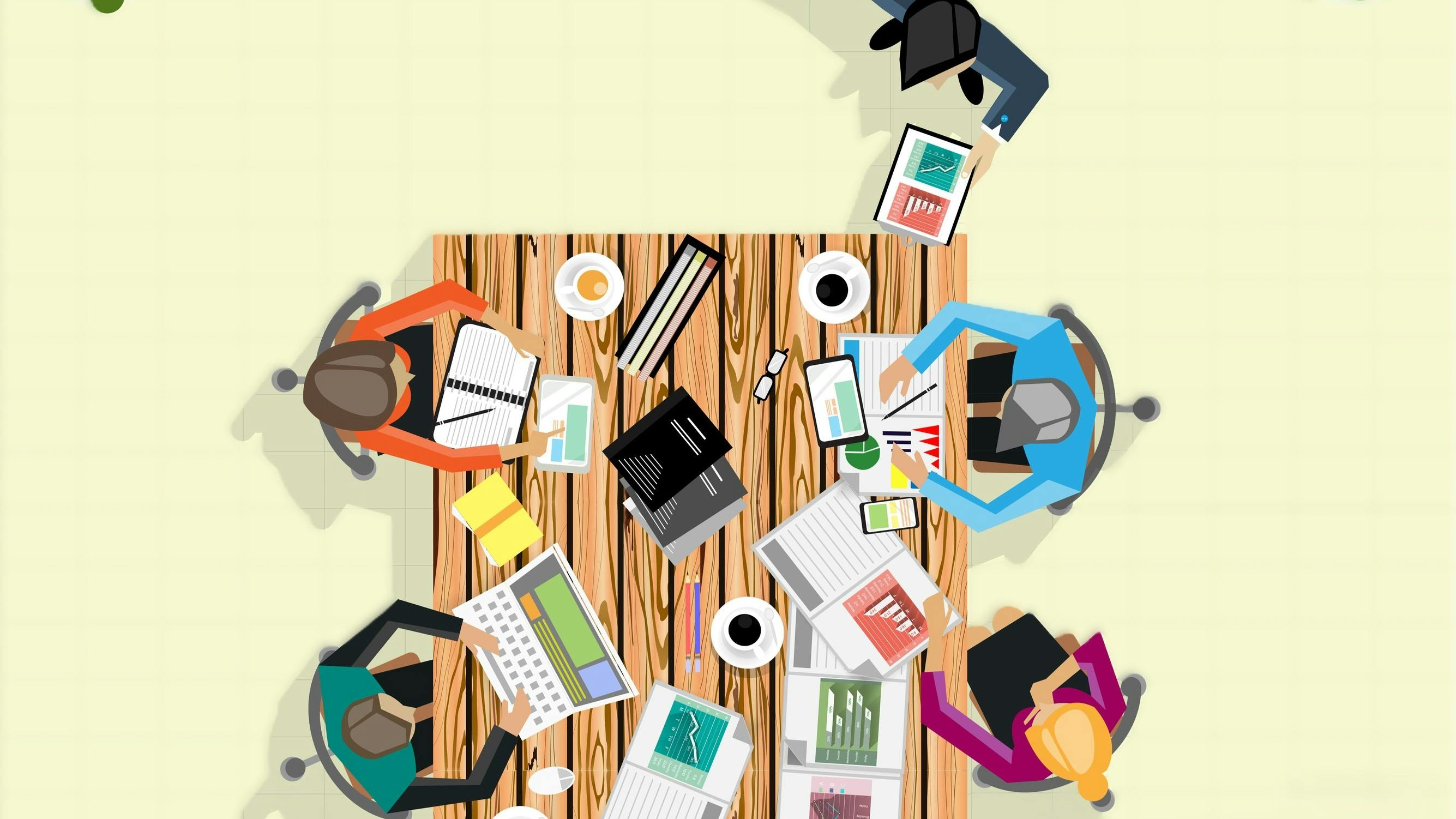 Vector graphic of business team sitting around a table, collaborating on a project