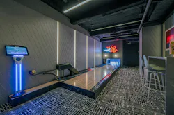 Smaller bowling alley space with a bar-top and counter-height seats