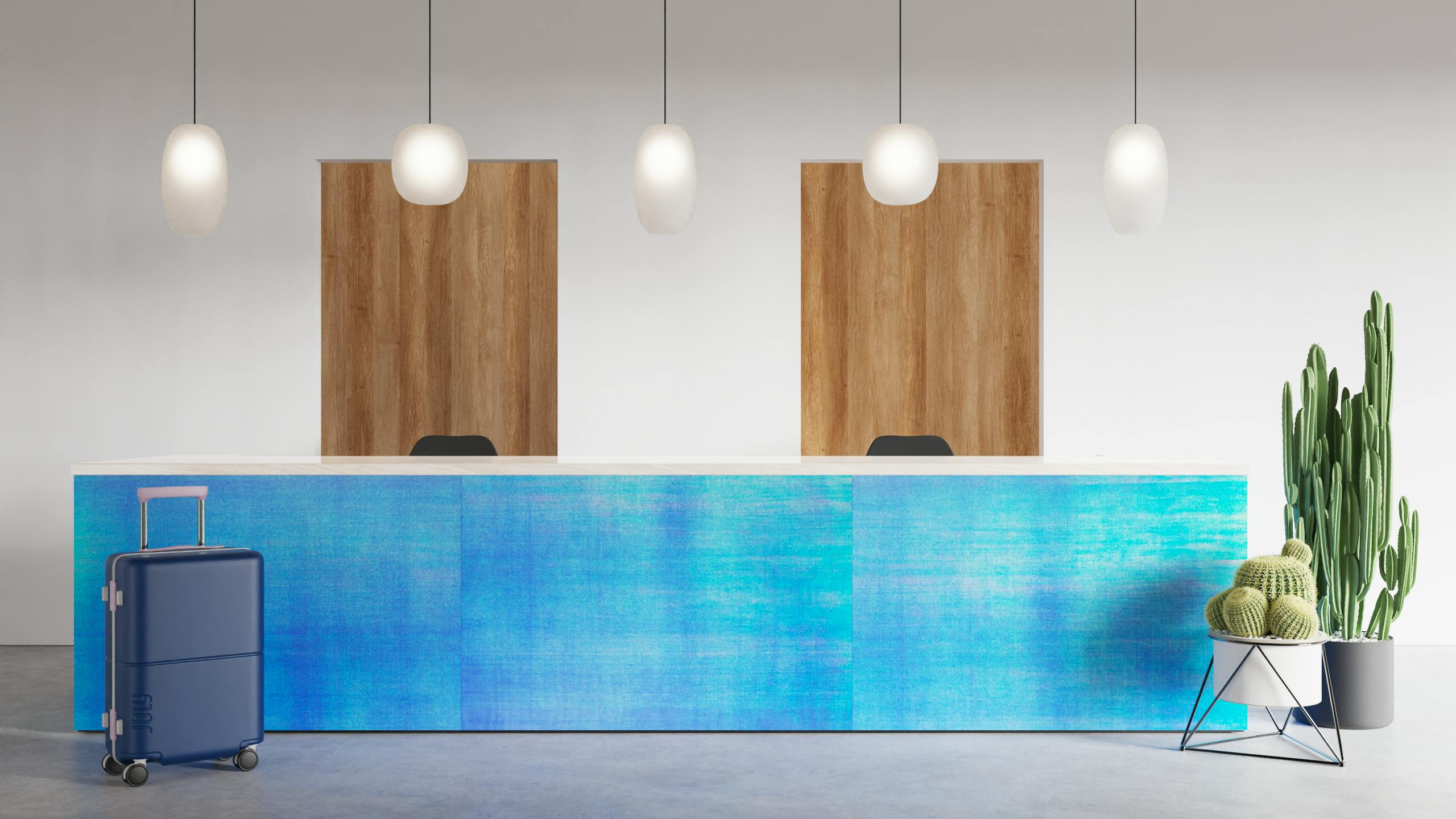 A reception desk with 3form's Pearlescent in midnight installed on the front. Luggage and faux cacti accent the desk.