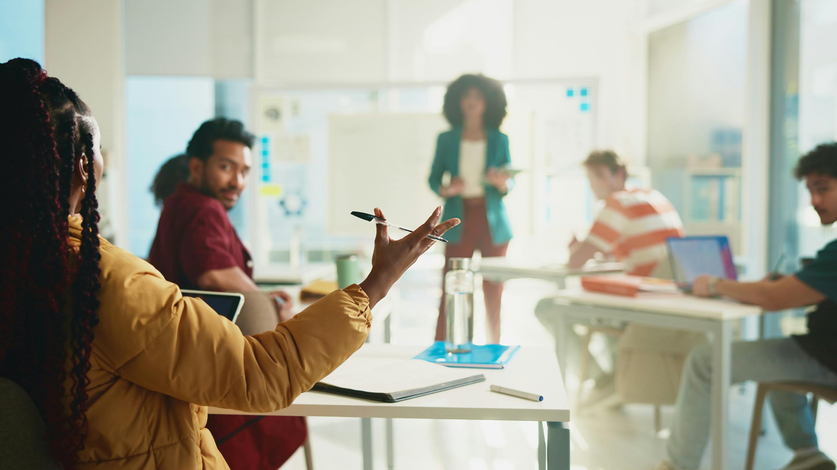 University students in classroom with professor