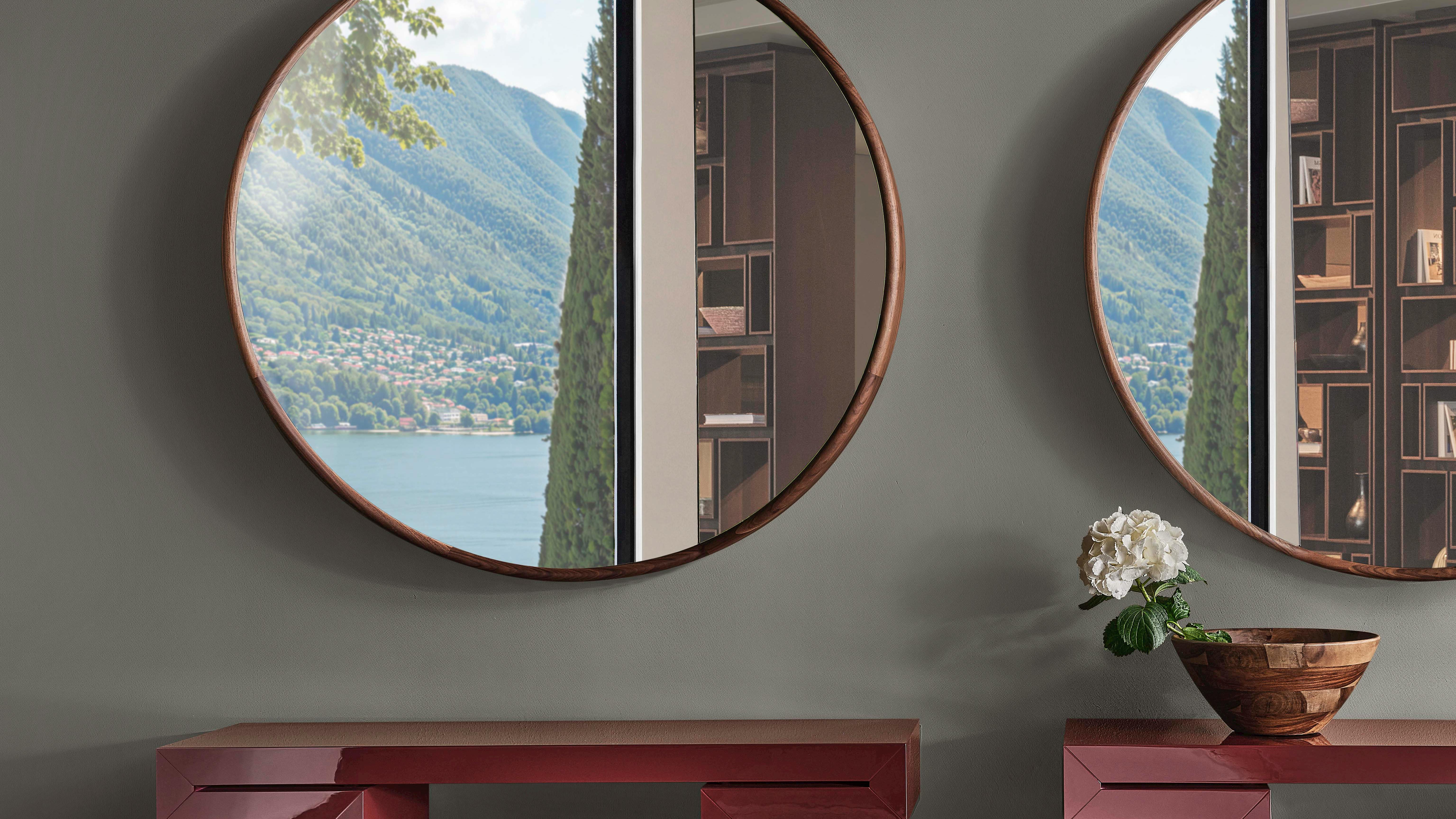 A collection of consoles with structure and top in glossy lacquered wood in the burgundy or lino finishes.