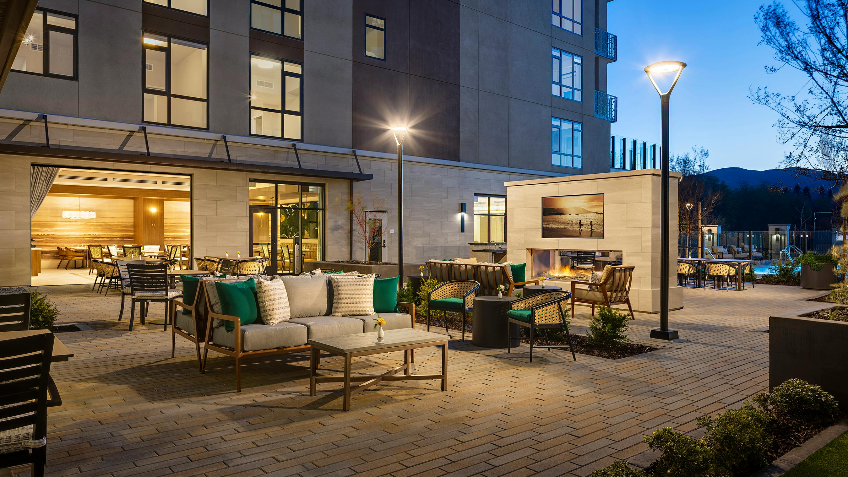 Courtyard with lounge seating, outdoor fireplace, and views of Northern California landscape