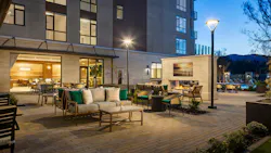 Courtyard with lounge seating, outdoor fireplace, and views of Northern California landscape